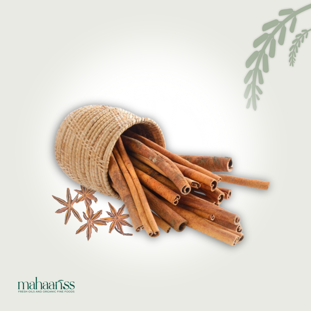 Cinnamon sticks in a woven container with star anise on a light background, featuring the brand 'maharaj'.