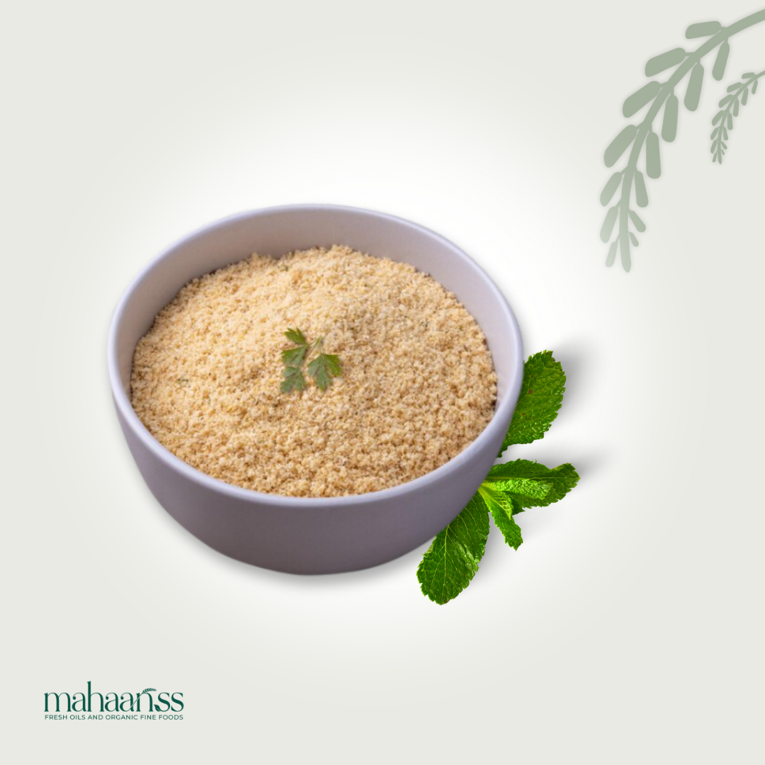 Bowl of beige powder with green leaves on a light gray background, featuring the brand 'mahaaaris'.