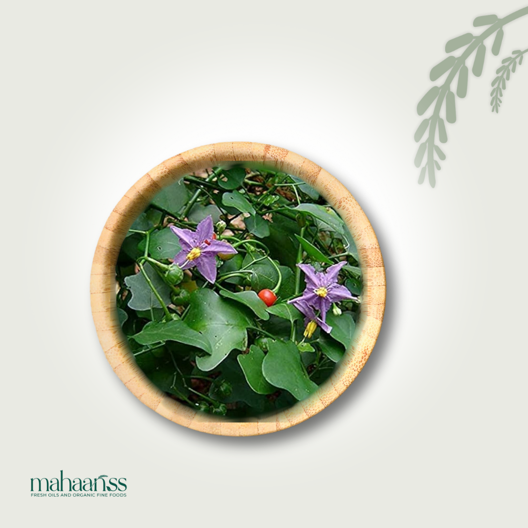 Bowl filled with green leaves and purple flowers on a light gray background, featuring the brand 'mahaanss'.