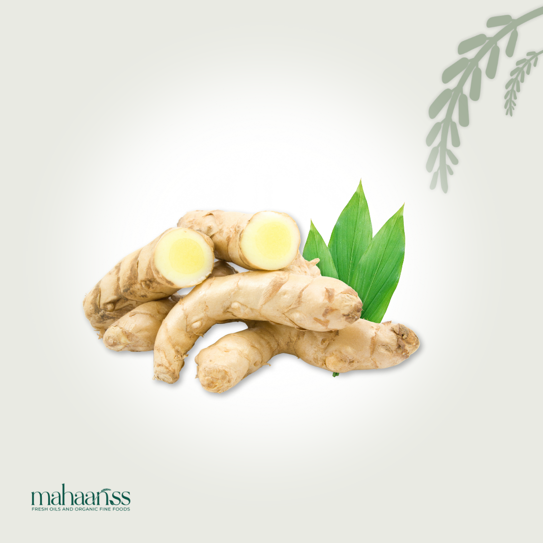 Ginger root with green leaves on a light gray background, featuring the brand 'maharajas'.