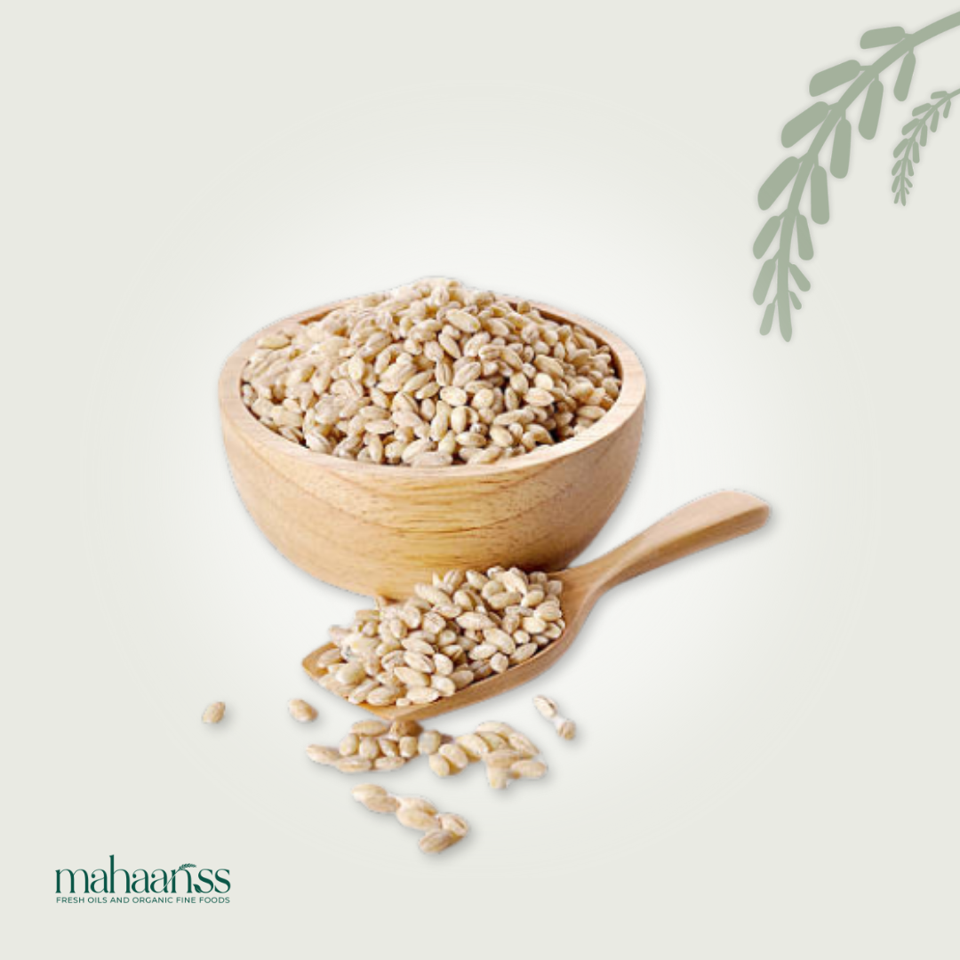 Wooden bowl and spoon with organic pearled barley on a light background, featuring the brand 'mahaanss'.