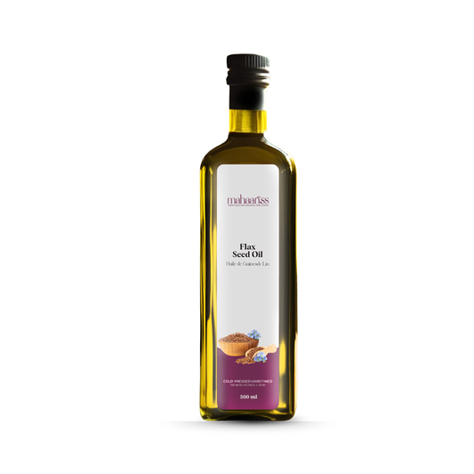 Bottle of flax seed oil with a label on a white background