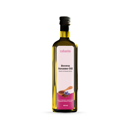 Bottle of Brown Sesame Oil with a pink label on a white background