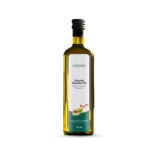 Bottle of natural sesame oil with a white label on a white background