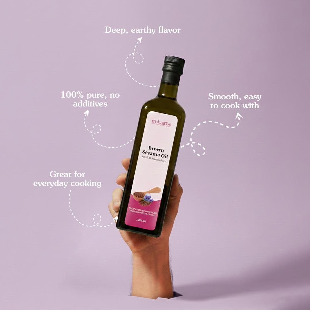 Hand holding a bottle of brown sesame oil with text on a purple background