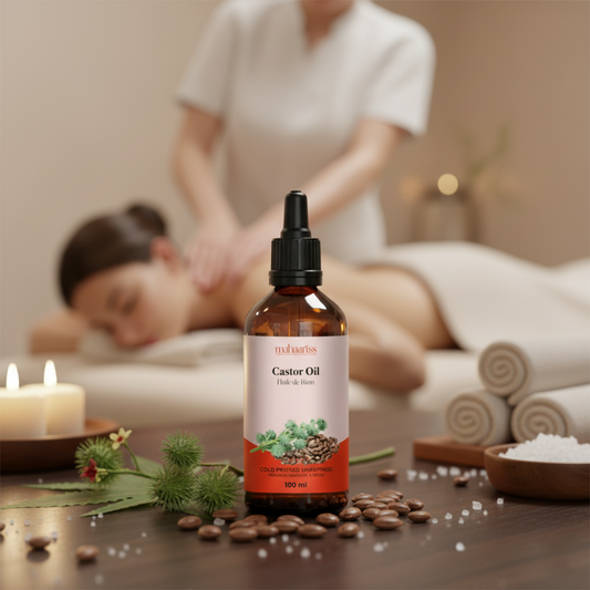 Caster oil bottle on a table with a blurred background of a massage session