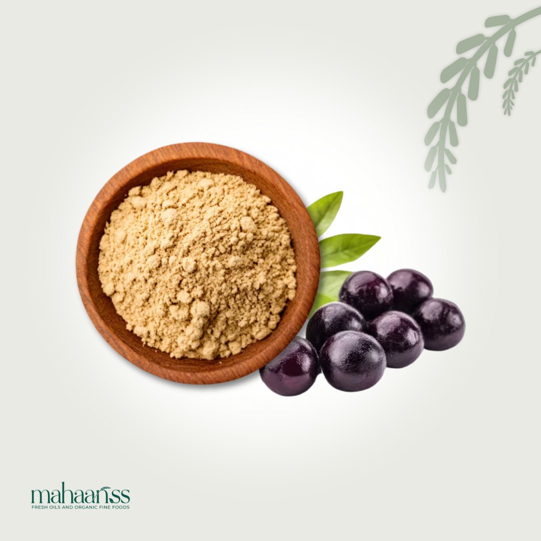Wooden bowl with Natural Naval Seed Powder, purple grapes, and green leaves on a light gray background with 'mahaanss' branding.