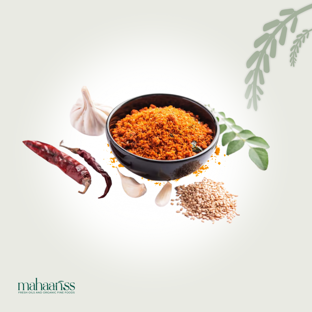 Spices including red chili, garlic, and a bowl of spice mix on a light background with 'mahaaaris' branding.