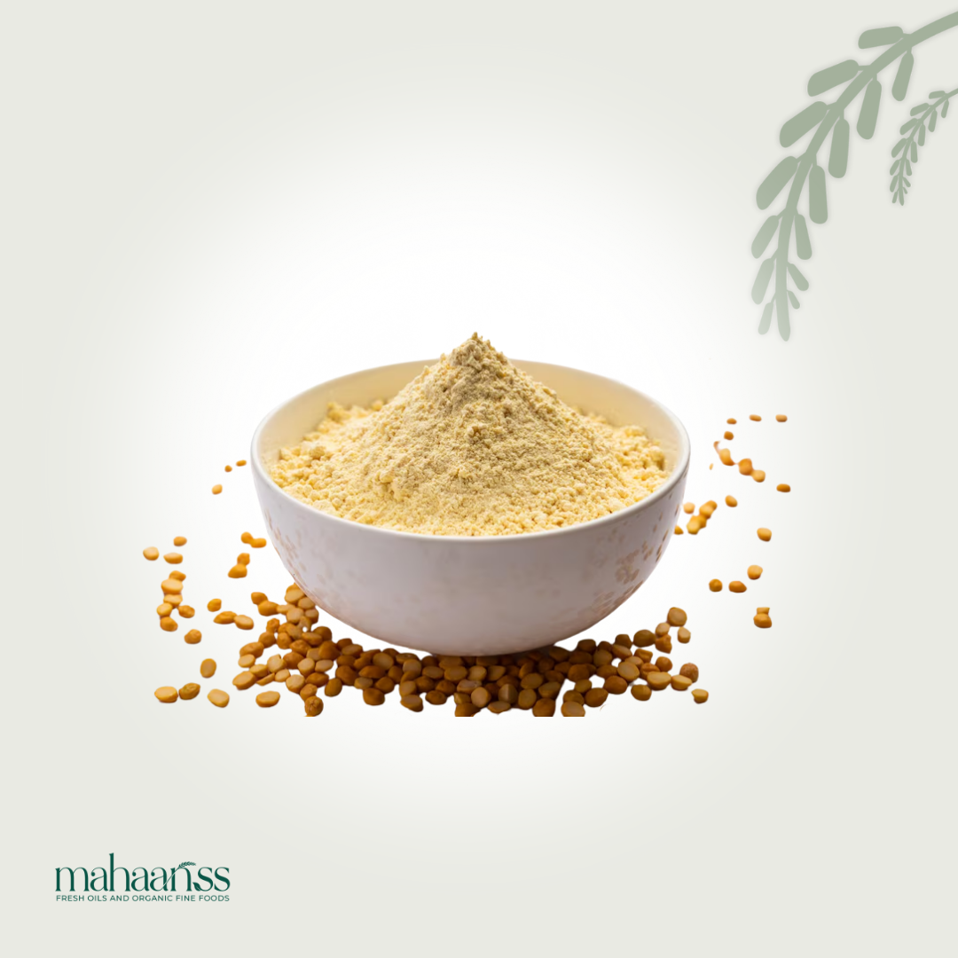 White bowl filled with yellow powder surrounded by scattered yellow seeds on a light gray background, with 'mahaaaris' branding.