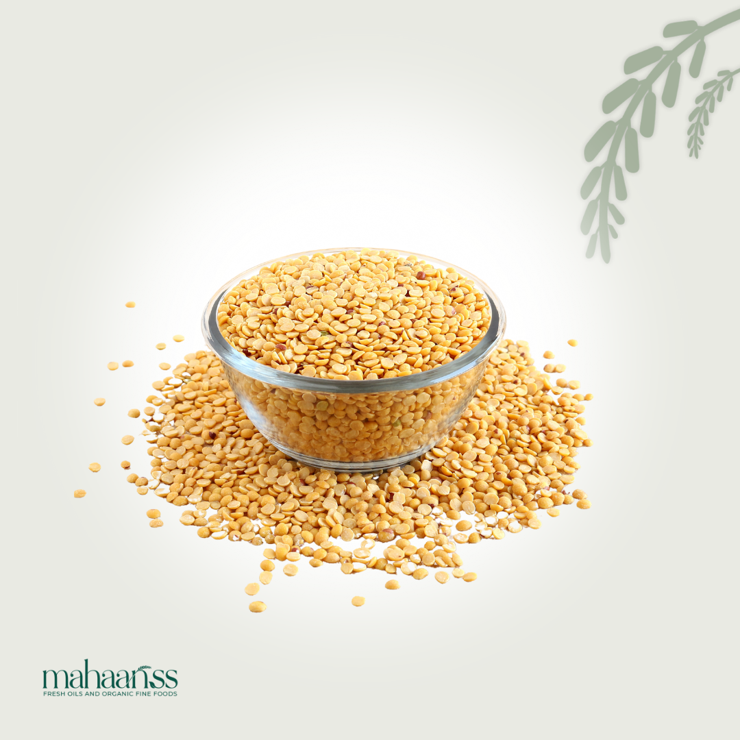 Glass bowl filled with yellow lentils on a light background with 'mahaaiss' branding.