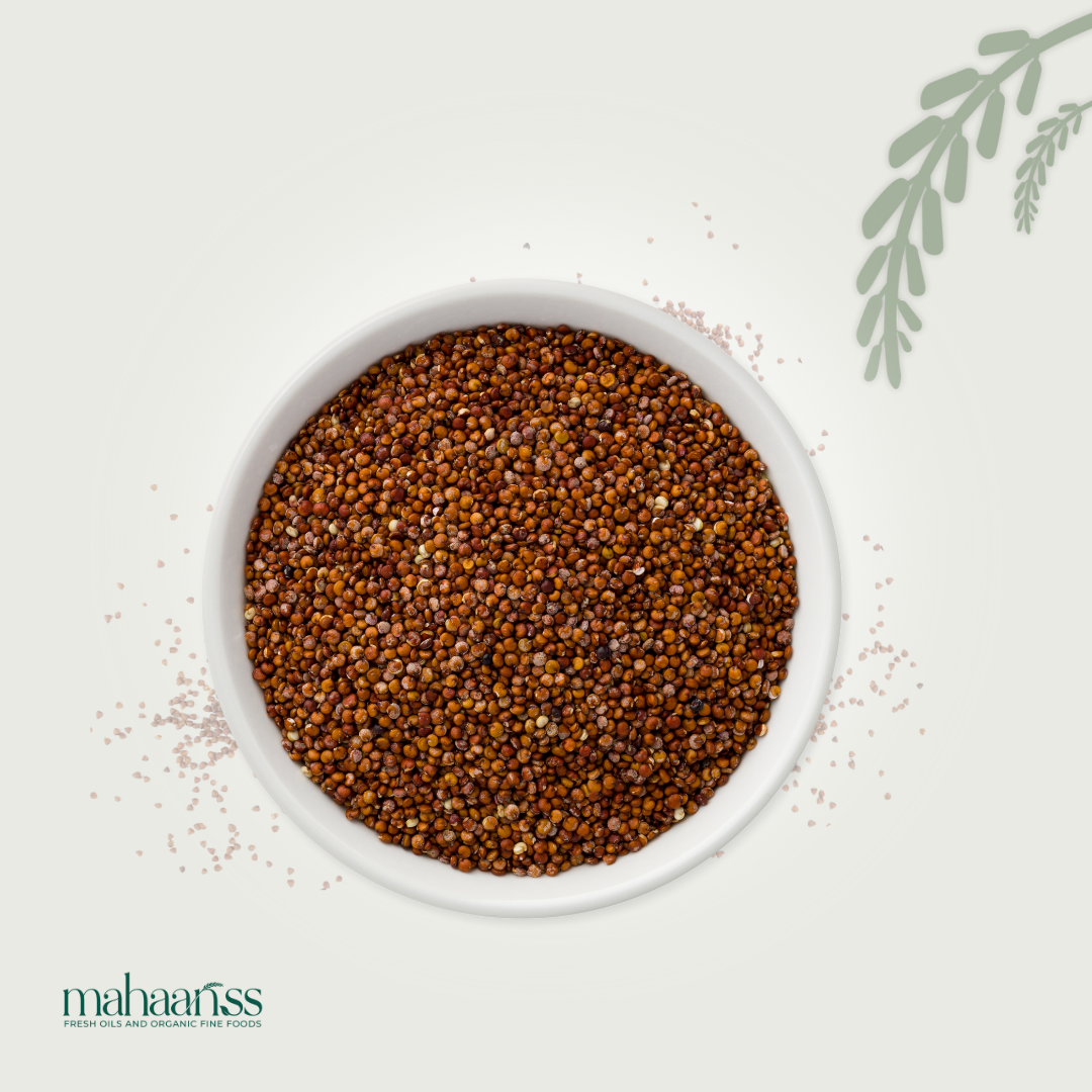 White bowl filled with organic red quinoa on a light background, featuring the brand 'mahaanss'.