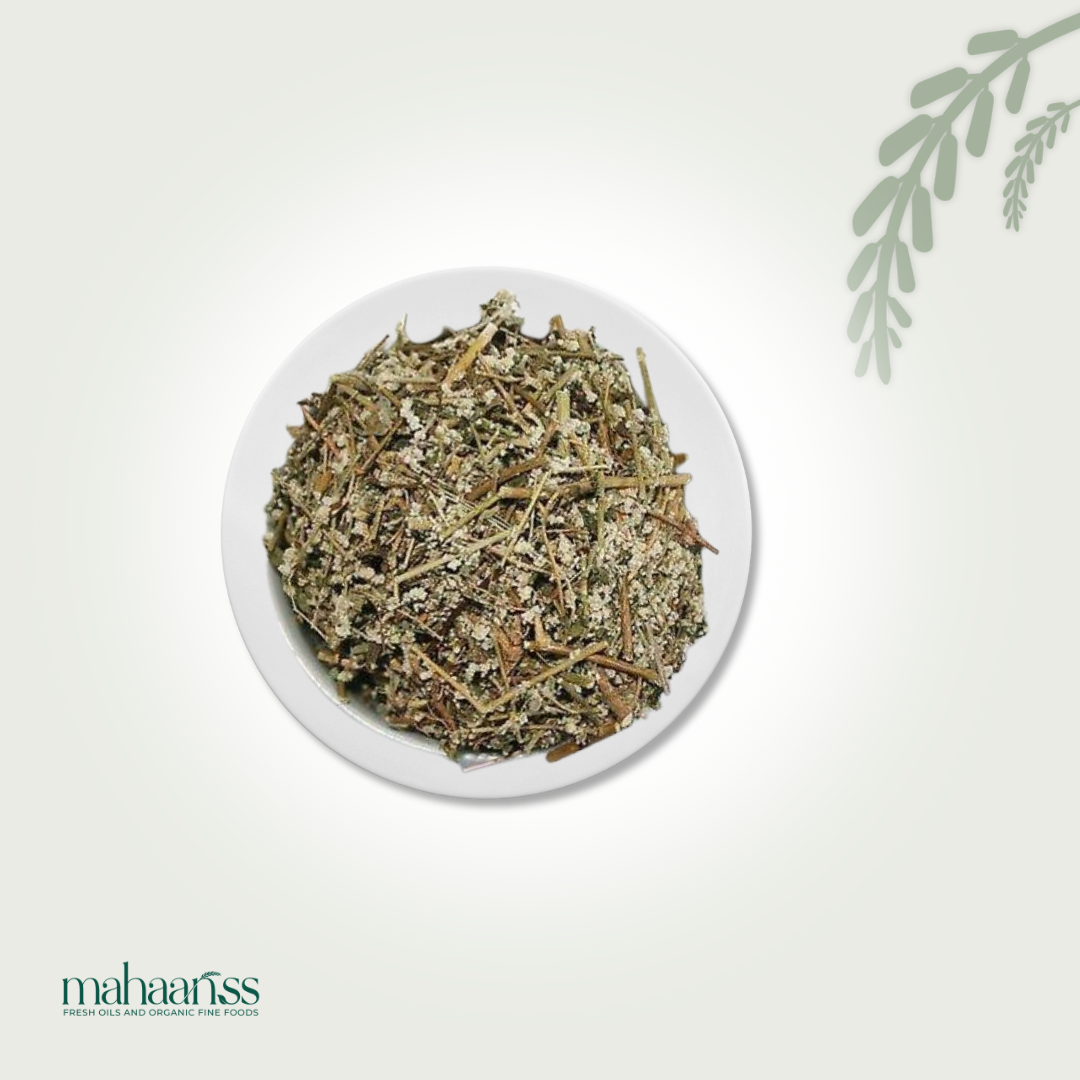 Dried mountain grass knot herbs in a white ceramic bowl on a light background